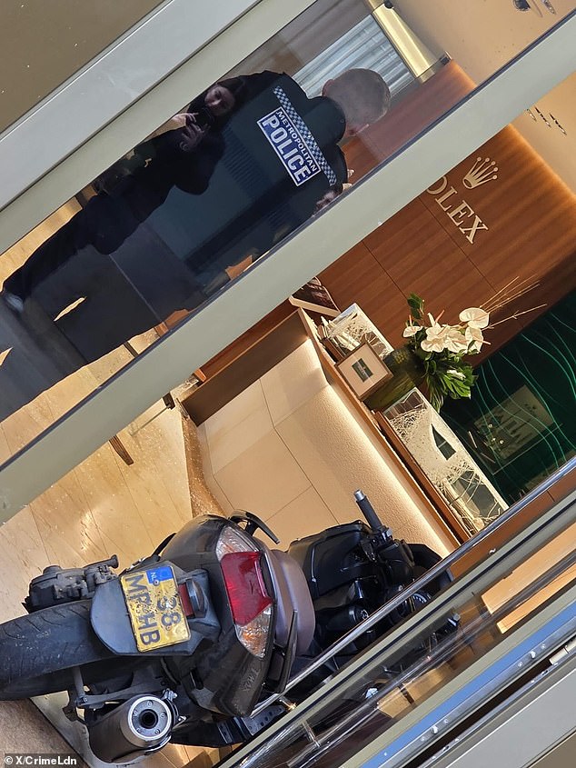 An image posted on social media shows smashed glass cabinets inside the boutique and an abandoned motorbike