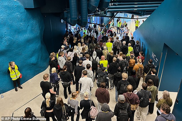 People enter a shelter designed to withstand chemical, nuclear and biological attacks during at civil defense exercise in Kuopio, Finland, Wednesday, September 2, 2026